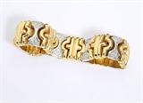 Lot# 1133 An Italian diamond and 14K two-tone gold bracelet 









Stamped ''Italy'', set with 96 full-cut diamonds totaling approximately 0.95 ct, graded H-I color and VS-SI clarity, 6.75'', 48.2 gms. est:$2000/3000