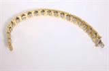 Lot# 1164 A diamond and 14K yellow gold square-link bracelet 









Set with 76 full-cut diamonds totaling approximately 2.30 cts, graded H-I color and SI clarity, 6.5'', 27.9 gms. est:$1200/1800