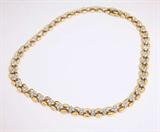 Lot# 1168 A diamond and 14K yellow gold necklace 









Set with 180 full-cut diamonds totaling approximately 7.20 cts and graded H-I color and SI clarity, 15.5'', 43.3 gms. est:$2500/3500