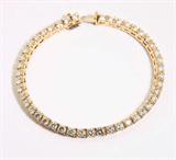 Lot# 1169 A diamond and 18K yellow gold tennis bracelet 









Set with 45 full-cut diamonds totaling approximately 5.85 cts, graded H-I color and SI clarity, 7.25'', 14.7 gms. est:$1750/2500