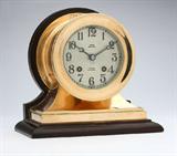 Lot# 1195 A Chelsea ship's clock, Negus 









First quarter 20th century, signed to dial Negus/ New York and ''Chelsea Ship's Bell'', mounted on a wooden base, with key. 8'' H x 8.5'' W x 4.75'' D. est:$500/700