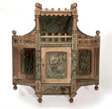 Lot# 1202 A carved, polychrome-painted and whitewashed oak hanging curio cabinet, Louis Steinhauser 









First half 20th century, decorated overall with poppies, irises, and an oak leaf and acorn garland, the hinged door surrounded by open shelves and uprights with ball finials, en suite with the following lots. 32'' H x 28'' W x 9'' D. est:$700/900