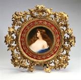 Lot# 1108 A KPM porcelain plaque, Wagner 









Late 19th / early 20th century, with impressed ''KPM'' and scepter mark, signed ''Wagner'', circular, depicting a brunette beauty in blue drapery, after Asti, with gilt-decorated red border, within a carved gilt wood frame, the plaque alone. 9.5'' Dia. est:$4000/6000