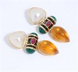 Lot# 1157 A pair of gem-set and 14K yellow gold door knocker earrings 









With citrine, black onyx, ruby cabochon, mabe pearl and chrysoprase, 2''. est:$1000/1500