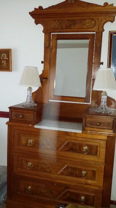 Anitque dresser with in laid wood, mirror ,3 drawers and two small drawers.