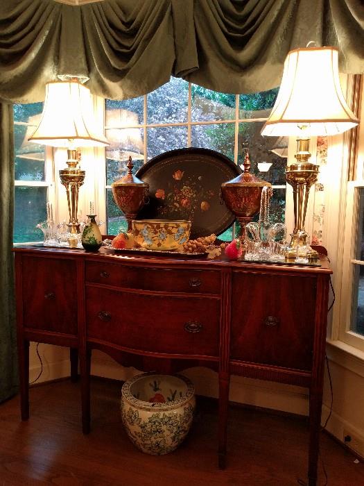 1940's mahogany sideboard, pair of very heavy brass lamps (I know they're good, just cannot find a maker's mark) large, English handpainted wooden tray, pair of decorative urns, Galle bowl and vase, collection of cut glass baskets, Asian porcelain fishbowl.                   Great Aunt Hulga was into fish...                                               I don't know which mortuary the swag window treatments were stolen from, but feel free to purchase them.