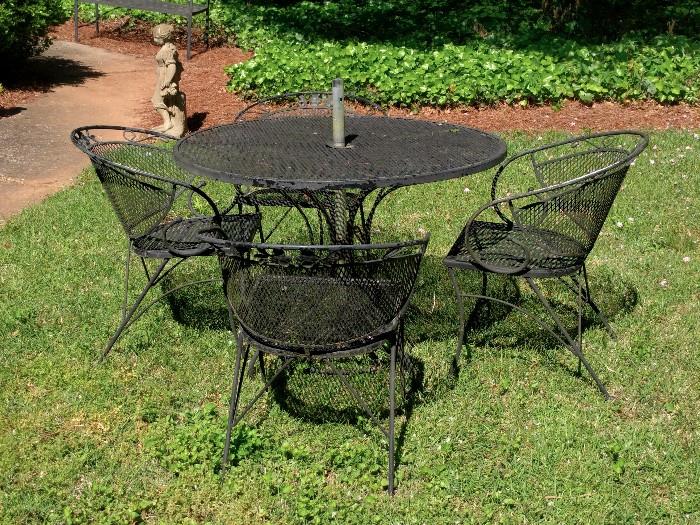 Vintage Outdoor metal mesh dining set at its finest.  Mary Poppins stole the umbrella.