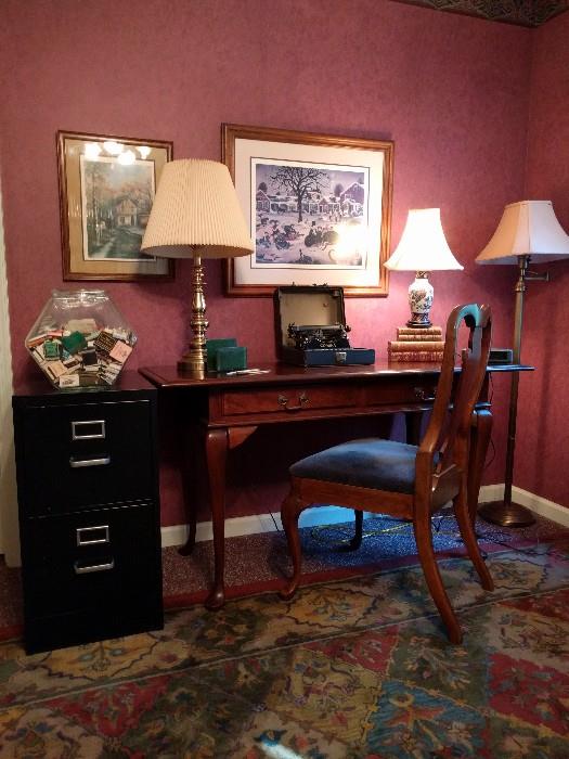 Here's where all the magic happens. I sit up late each night, typing snarky descriptions on this 1911 hunt & peck typewriter, only to have my IT guy transfer all of my wit to the MAC. Homely, but useful 2-drawer file cabinet, 1980's mahogay (probably Bombay) 2-drawer writing desk, bad art, a nice stack of antique leather books, all atop a hand tufted, 100% wool rug. Dig the rosy wallpaper - you can have it, just ask.