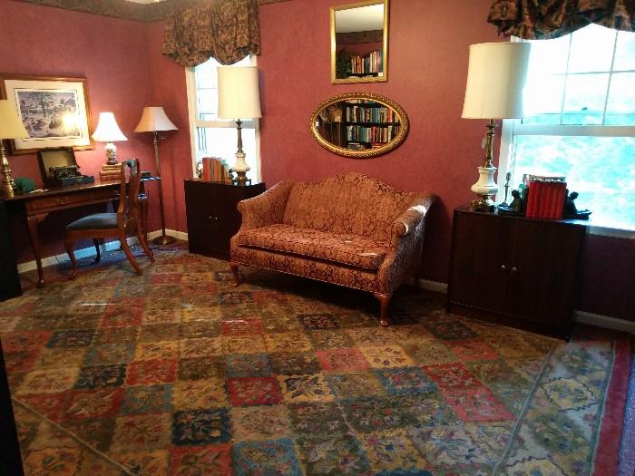 There's a great shot of the casting couch. It's in great condition, so you know business has been slow.... A pair of vintage Stiffel Lenox table lamps, w/original shades, pair of mahogany bookshelves.