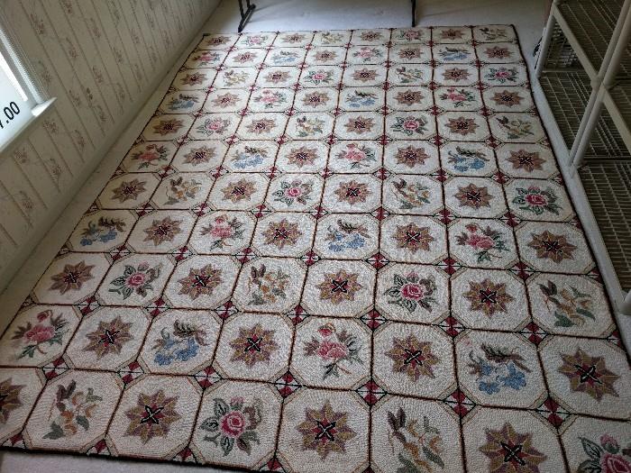 Needlepointed rug, hand made, 100% wool, measures 8' 2" x 11'