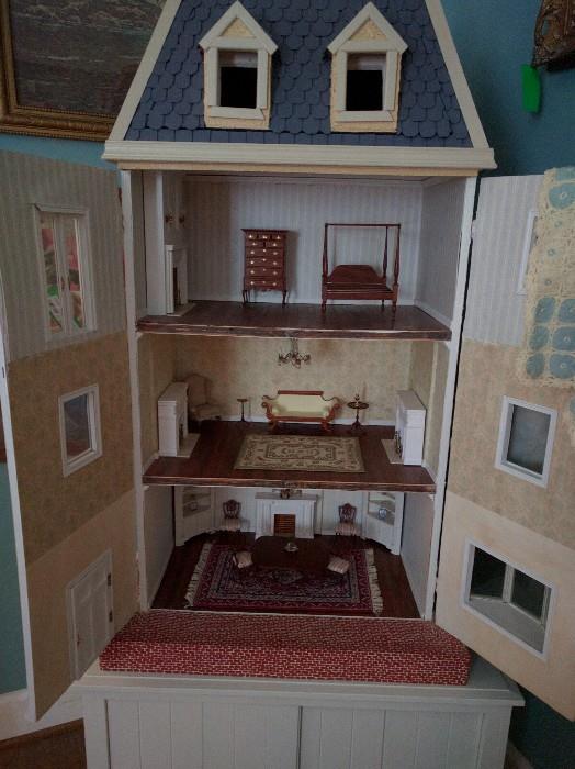 If you can't afford the Victorian wonder dollhouse previously pictured, you can start here. This is the Savannah dollhouse. See all those miniature pieces in there? You really should check out the journal, which documents the maxiature prices paid for those little things - they're all signed by artisans. Really.