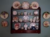Just like the Biblical Hanging Gardens of Babylon, this mahogany wall shelf is loaded with items just as important.                                                                              Note the set/4 hand-painted plates - they're pretty nice.