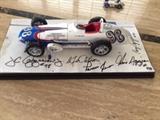 Watson Roadster 1:18 scale by Carousel 1 – #98 Agajanian’s Willard Battery Special- 1962 Indy 500 Pole Sitter w/ the following Autographs: a.Parnelli Jones (Driver)
b.AJ Watson (Builder & Chief Mechanic)
c.J.C Agajanian, Jr.; Chris Agajanian; Cory Agajanian (Owners – aka The Agajanian Brothers)
