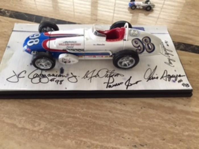 Watson Roadster 1:18 scale by Carousel 1 – #98 Agajanian’s Willard Battery Special- 1962 Indy 500 Pole Sitter w/ the following Autographs: a.Parnelli Jones (Driver)
b.AJ Watson (Builder & Chief Mechanic)
c.J.C Agajanian, Jr.; Chris Agajanian; Cory Agajanian (Owners – aka The Agajanian Brothers)
