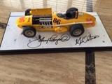 Watson Roadster – #86 –Bardahl Special- 1964 Indy 500 runner w/ the following Autographs:
Johnny Rutherford (Driver) and AJ Watson (Builder & Chief Mechanic)
