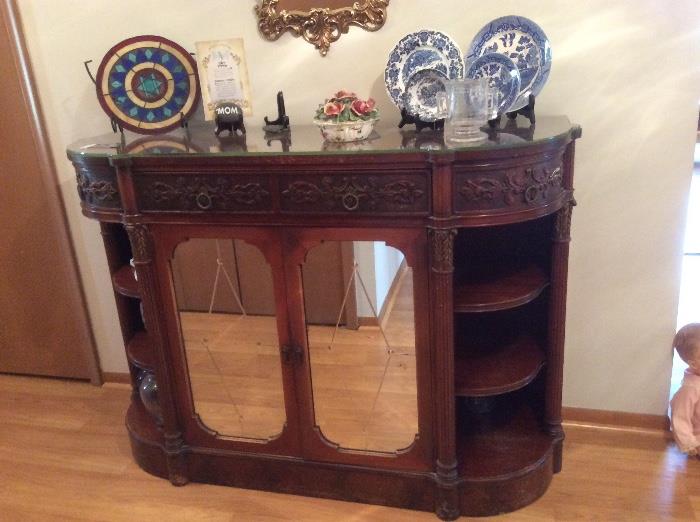Vintage mirrored buffet with intricately carved detail