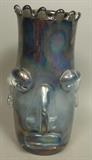Lot 21:  MIHAI TOPESCU Romania Art Glass Face Vase. Applied facial features. Bluish gray iridescent finish. Paper label. : Dimensions:  H: 10 inches: W: 6 inches: D: 6 inches --- US Shipping charge: $35