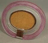 Lot 30:  Murano Art Glass Oval Picture Frame. Double Pink & Clear Ribbed Glass Frame. Opening is 4.5"H x 6.25W: Dimensions:  H: 10 inches: W: 10.75 inches --- US Shipping charge: $35