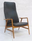 Lot 56:  Danish Modern Lounge Chair. Paddle arm. Adjustable. Black vinyl. : Dimensions:  H: 40.5 inches: W: 28.5 inches: D: 27 inches --- 