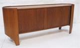 Lot 67:  HENRY P GLASS for RICHBILT Teak Credenza. Rounded Sides. Tambour Doors. Raised lip to top. Unique leg line detail. : Dimensions:  H: 30.5 inches: W: 71 inches: D: 18 inches --- 