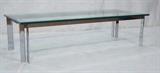 Lot 93:  Chrome and Glass Coffee Cocktail Table. 1" thick glass top on double band angled legs.: Dimensions:  H: 15.5 inches: W: 60 inches: D: 24 inches --- 