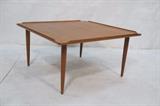 Lot 108:  Danish Modern Teak Square Coffee Table. Raised lip on cocktail table with tapered peg legs. Danish control tag. : Dimensions:  H: 16.5 inches: W: 32 inches: D: 32 inches --- 