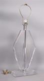 Lot 120:  Lucite Diamond Shape Table Lamp. Sun ray details. : Dimensions:  H: 29.5 inches: W: 11 inches: D: 5 inches --- 
