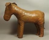 Lot 151:  ABERCOMBIE FITCH style Large Leather  Donkey Sculpture. Eeyore. Fabric label to belly: ? ? ?, Harvard Square.  : Dimensions:  H: 20 inches: W: 24 inches: D: 8 inches --- 