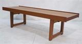 Lot 169:  MELLEMSTRANDS Norway Modern Teak Bench. Open "U" form legs with black metal bracket supports. Marked. BRUKSBO. : Dimensions:  H: 13.5 inches: W: 48 inches: D: 14.5 inches --- 