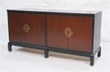 Lot 178:  Ebonized Asian inspired Credenza Sideboard. Four Doors with contrasting reddish stain and brass Asian style hardware. Raised on legs. : Dimensions:  H: 30 inches: W: 60 inches: D: 19 inches --- 