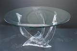 Lot 187:  Large SHLOMO HAZIZA Lucite & Glass Coffee Table. Three twisted lucite legs support beveled glass top. Label: Dimensions:  H: 16.5 inches: W: 41 inches: D: 41 inches --- 