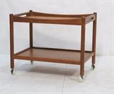 Lot 197:  Hans Wagner Bar Cart. Danish Modern Andreas Tuck Teak Rolling Serving Bar Cart. : Dimensions:  H: 24 inches: W: 18.5 inches: D: 28.5 inches --- 