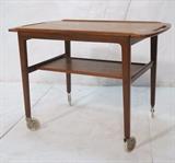 Lot 198:  Danish Modern Teak Rolling Serving Bar Cart. On casters. Removable top tray. : Dimensions:  H: 24 inches: W: 33 inches: D: 19 inches --- 