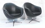 Lot 261:  Pr Black Overman Swivel Lounge Chairs. One has overman tag. : Dimensions:  H: 30.5 inches: W: 32.5 inches: D: 27 inches --- 