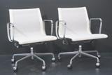 Lot 263:  Pr Aluminum Group HERMAN MILLER Office Chairs. White mesh on metal frame. Recline and Swivel. : Dimensions:  H: 31 inches: W: 22.5 inches: D: 22 inches --- 