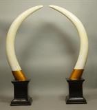 Lot 299:  Pr Faux Tusk. Lacquered Finish.  Decorator. Ebonized bases: Dimensions:  H: 32 inches: W: 12 inches --- 