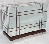 Lot 304:  Contemporary Mirrored Decorator 3 Drawer Bachelors Chest. Mirrored panels set in Gridlike wood frame. Recessed mirrored pulls.: Dimensions:  H: 35.5 inches: W: 47 inches: D: 21.5 inches --- 