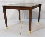 Lot 337:  Decorator Square Occasional Table. Inset Eglomise glass top. Angled tapered legs with gold gilt feet. Designer modernist. : Dimensions:  H: 29 inches: W: 36 inches: D: 36 inches --- 