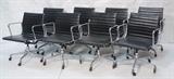 Lot 358:  Set 8 ALUMINUM GROUP Office Chairs. Metal frames. Black leather. On casters. Not Marked. CHARLES EAMES style: Dimensions:  H: 32.5 inches: W: 23 inches: D: 21 inches --- 