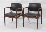 Lot 387:  Pr ORUM Danish Modern Teak Arm Side Chairs. Black Leather. Marked. : Dimensions:  H: 31.5 inches: W: 24.5 inches: D: 18 inches --- 