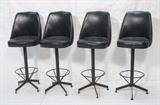 Lot 389:  Set 4 Mid Century Bar Stools. Black Vinyl on Black metal Frames. Swivel. : Dimensions:  H: 49 inches: W: 19 inches: D: 18 inches --- 