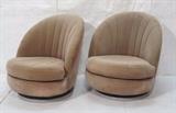 Lot 391:  Pr MILO BAUGHMAN for THAYER COGGIN Swivel Lounge Chairs. Round channel upholstered backs. On gray enamel painted bases. Label. Height of seat is 15.5" high. : Dimensions:  H: 32 inches: W: 30 inches: D: 33 inches --- 