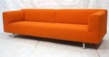 Lot 396:  Large Orange Modernist Sofa Couch. Tubular chrome legs.  Squared form. Not marked: Dimensions:  H: 29 inches: W: 98 inches: D: 33 inches --- 