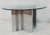Lot 335:  Heavy Stainless Steel and Glass Cocktail Coffee Table. Staggered large square columns.  Thick glass top.  Habitat Style.: Dimensions:  H: 16 inches: W: 30 inches --- 