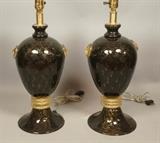 Lot 416:  Pr Black Murano Art Glass Table Lamps. Urn Form with applied gold glass medallions and triple band accent above swollen base. Interior design details to glass. : Dimensions:  H: 28 inches: W: 7.5 inches: D: 7.5 inches --- 