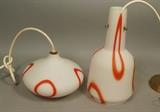 Lot 435:  2pc LIGHTOLIER Art Glass Hanging Pendant Lights. Frosted white with orange designs. One is marked Lightolier: Dimensions:  H: 13 inches: W: 6 inches: D: 6 inches --- 