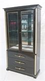 Lot 440:  Tall TOMMI PARZINGER style Ebonized Cabinet. Two door with inset glass panels.  Unique large brass pulls. Brushed brass trim. Parzinger attribution. : Dimensions:  H: 80.25 inches: W: 42 inches: D: 18 inches --- 