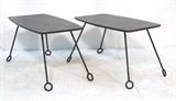 Lot 476:  Pr JEAN ROYERE style Black Side Tables. Black iron legs with open loop feet. Black laminate tops. : Dimensions:  H: 18 inches: W: 29.25 inches: D: 17.5 inches --- 