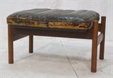 Lot 485:  Modern Teak Norway Black Letaher Footstool Ottoman. DEKKA Mobler label. . : Dimensions:  H: 16 inches: W: 26 inches: D: 20 inches --- 