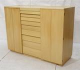 Lot 497:  DUNBAR Blond Wood Cabinet Armoire. Two bifold doors. Nine drawers with "louver" fronts. Flip top with mirror. : Dimensions:  H: 45 inches: W: 60 inches: D: 21 inches --- 